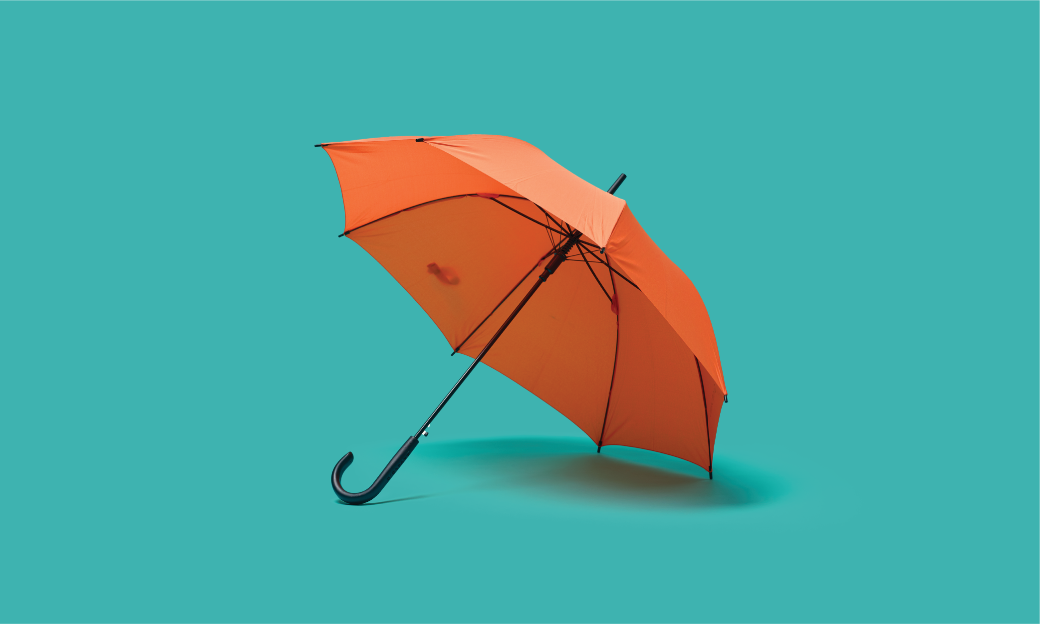 An umbrella given to mother and son caught in a downpour by a passing taxi driver, who was himself drenched in the process.